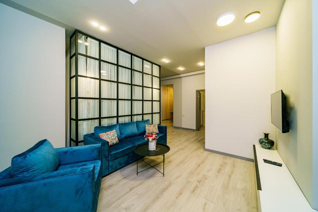TV a/nebo společenská místnost v ubytování Sweet Home Apart-Hotel