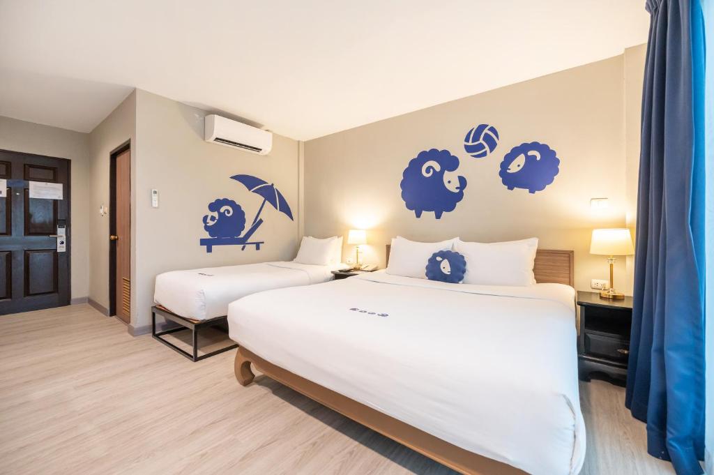 Postel nebo postele na pokoji v ubytování Kokotel Krabi Ao Nang