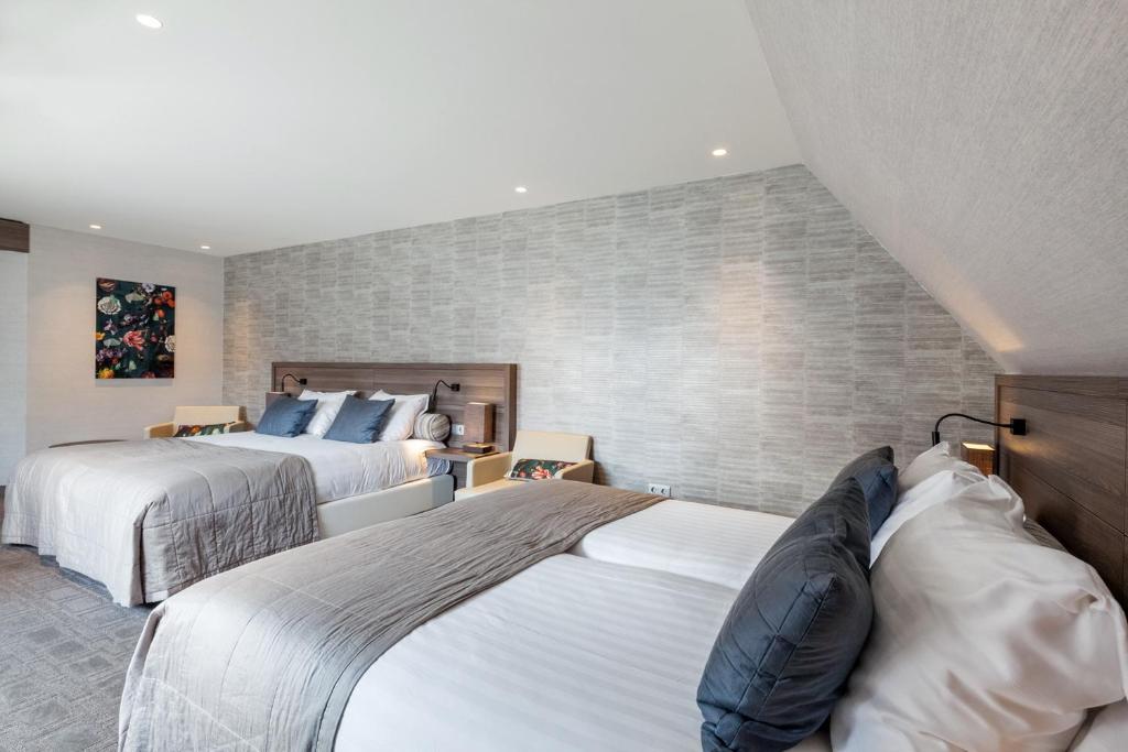 Postel nebo postele na pokoji v ubytování Van der Valk Hotel Hengelo
