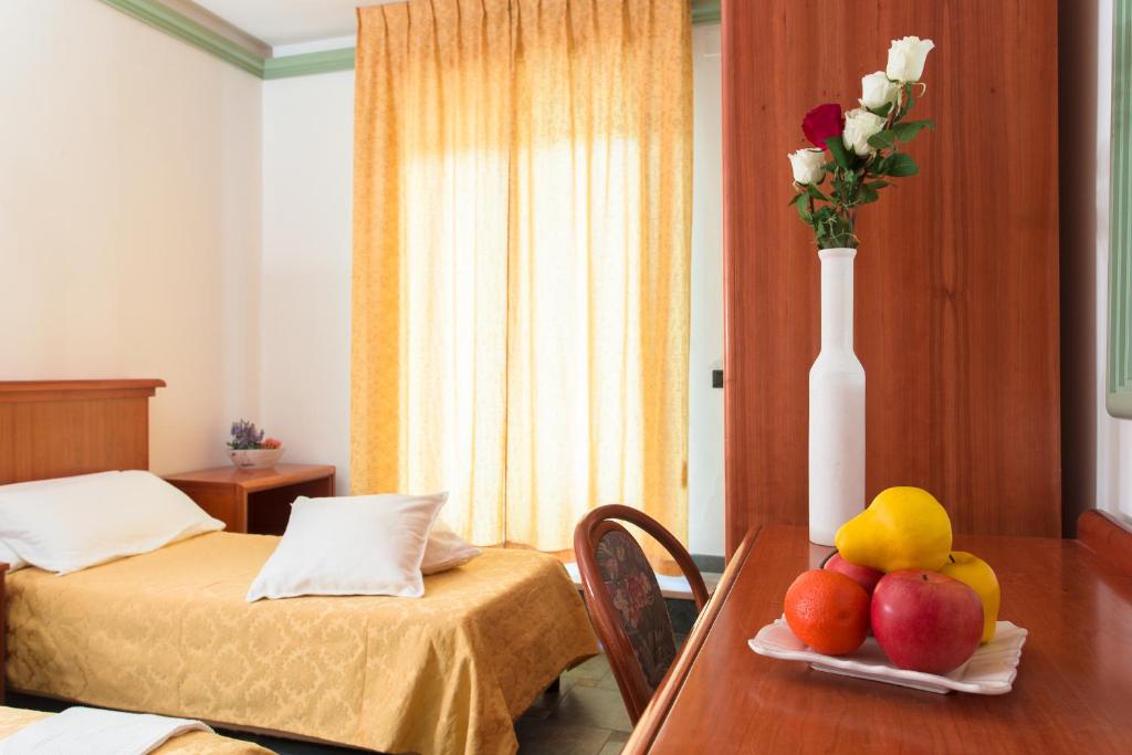 Postel nebo postele na pokoji v ubytování Hotel Zeus