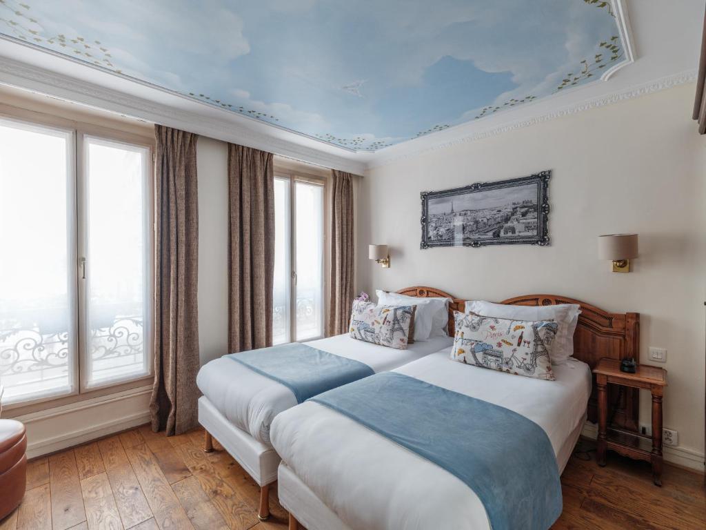 Postel nebo postele na pokoji v ubytování Hotel Minerve