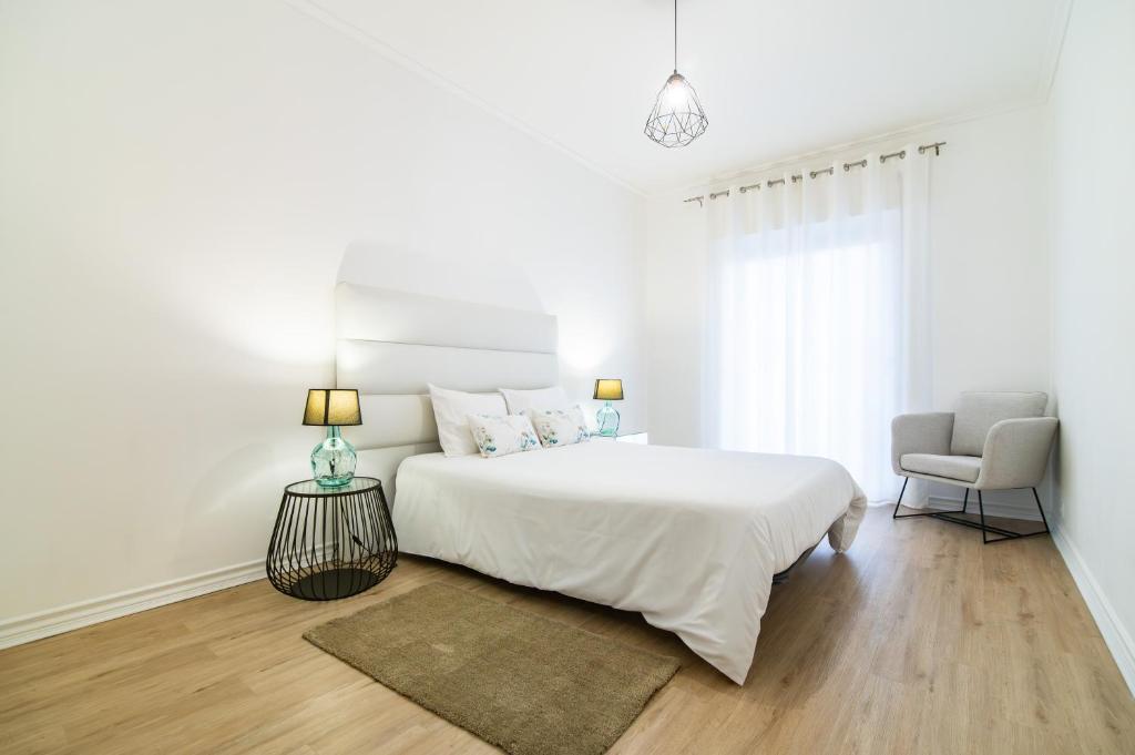 Ένα ή περισσότερα κρεβάτια σε δωμάτιο στο Green Island City Apartment