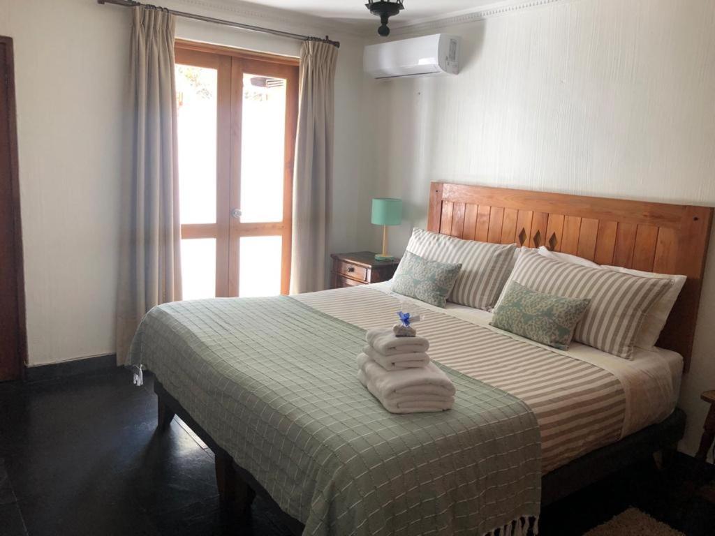 Uma cama ou camas num quarto em Casa Arrayán