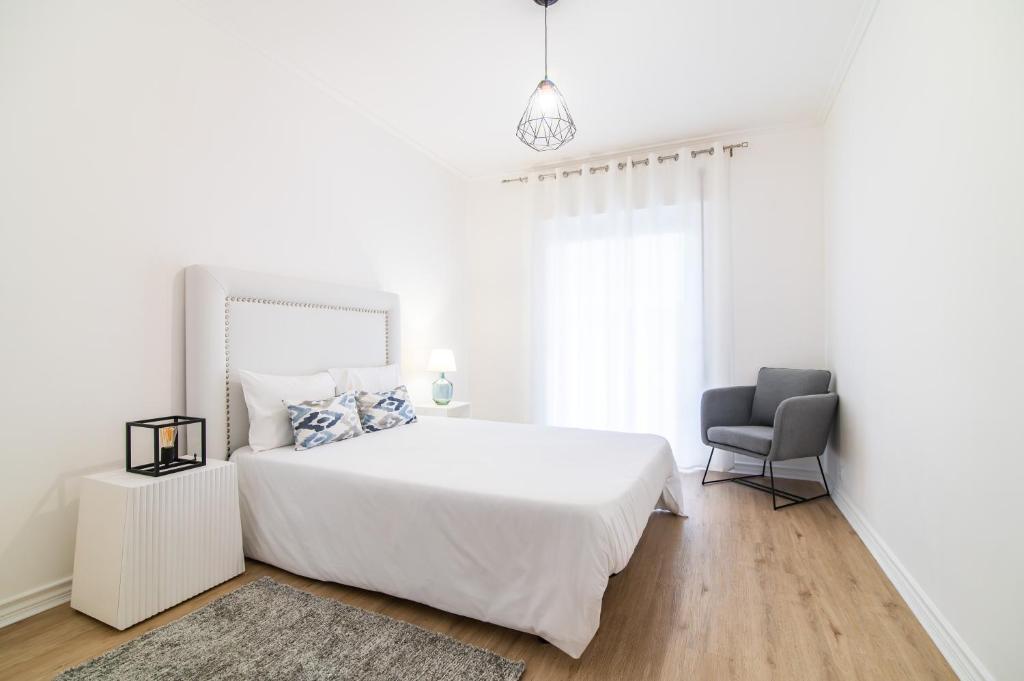 Postel nebo postele na pokoji v ubytování Green Island City Apartment