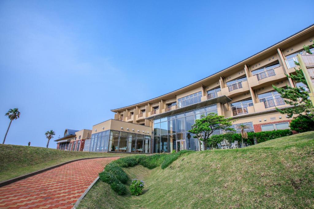 a building with a brick walkway in front of a building at Ocean Resort Nomon長崎 in Nomo