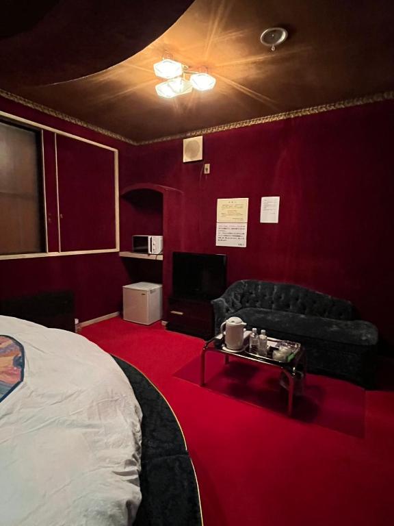 Postel nebo postele na pokoji v ubytování ロビンホテルRobin Hotel