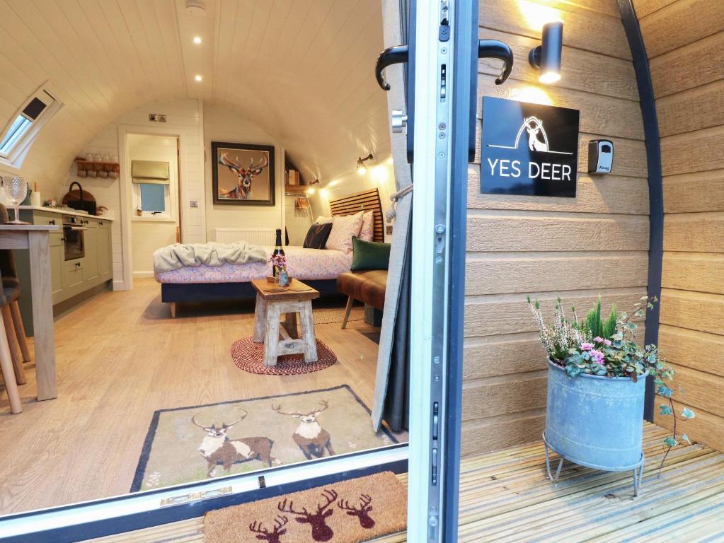 a tiny house with a living room and a kitchen at Yes Deer in Ashbourne