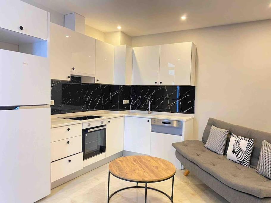 a kitchen with a couch and a table in a room at Jasmin 4 in Alanya