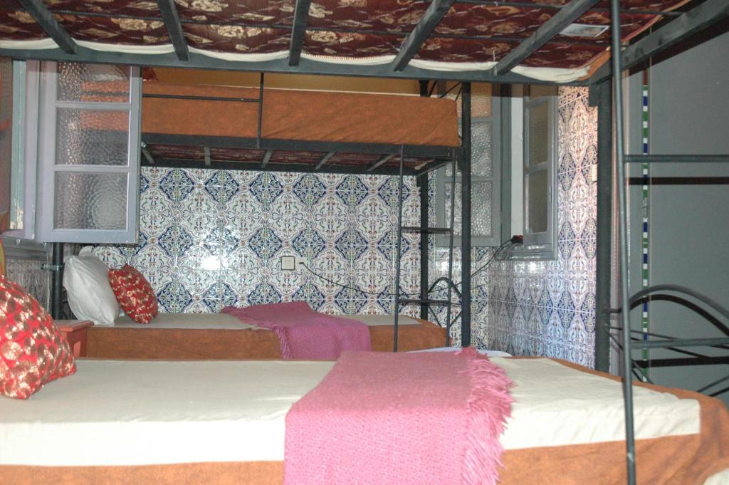 Postel nebo postele na pokoji v ubytování kech hostel