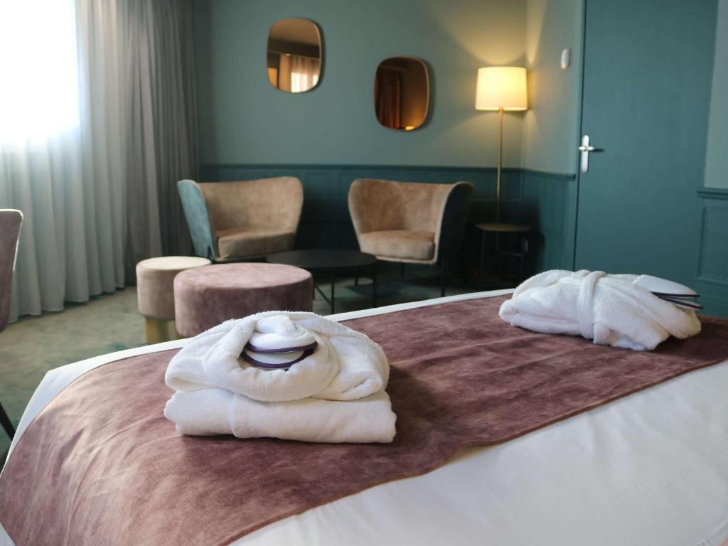 Postel nebo postele na pokoji v ubytování Hôtel Mercure Lyon Centre Charpennes Parc de la Tête d'Or