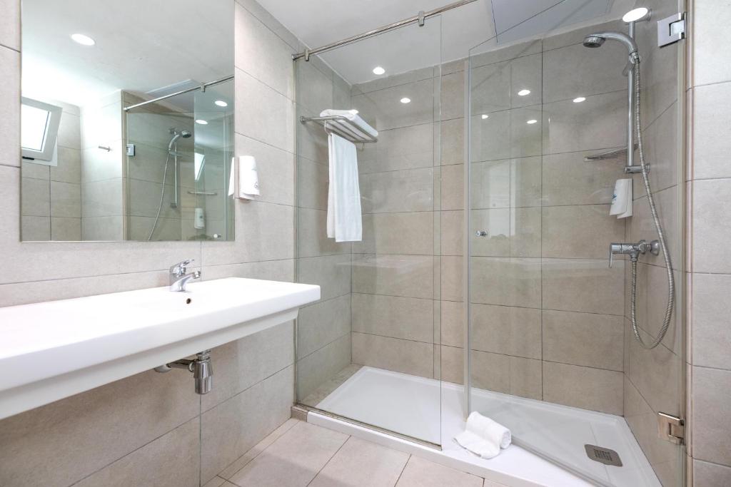 a bathroom with a shower and a sink and a mirror at Labranda Marieta & Spa - Adults Only in Playa del Ingles