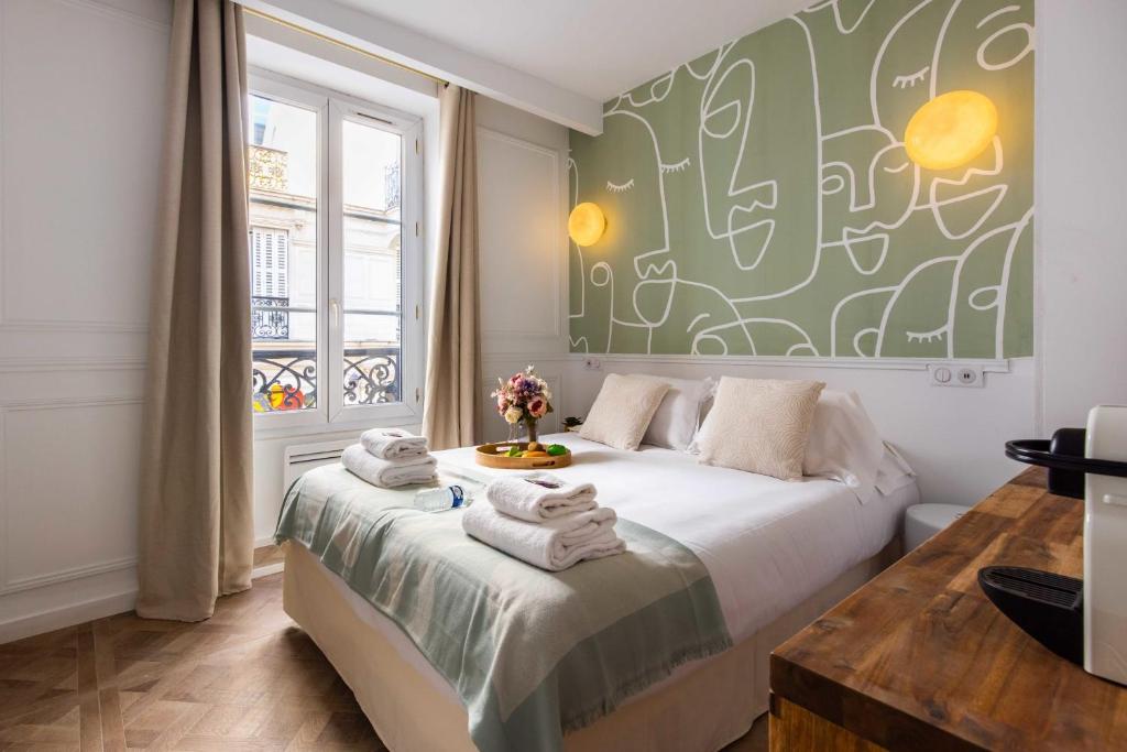 Posteľ alebo postele v izbe v ubytovaní CMG - Résidence Sacré Coeur - MONTMARTRE