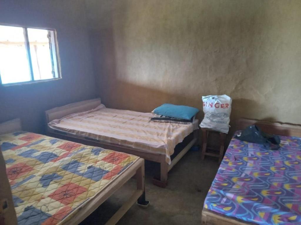 Postel nebo postele na pokoji v ubytování Sinharaja Sky Residence