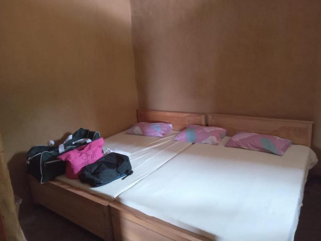 Postel nebo postele na pokoji v ubytování Sinharaja Sky Residence