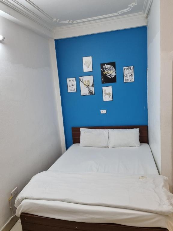 Postel nebo postele na pokoji v ubytování Bluebell Hotel