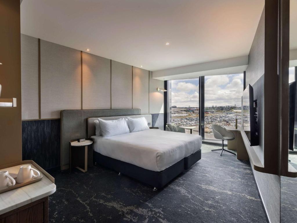 Postel nebo postele na pokoji v ubytování Pullman Auckland Airport