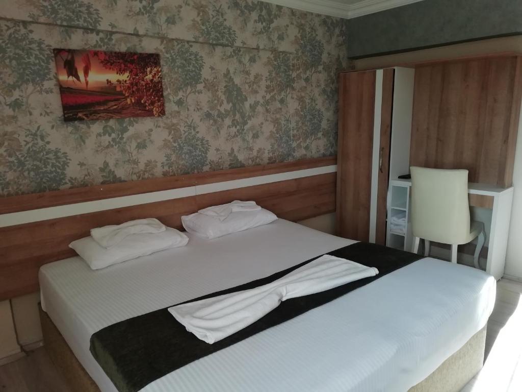 Postel nebo postele na pokoji v ubytování Grand Ece Hotel