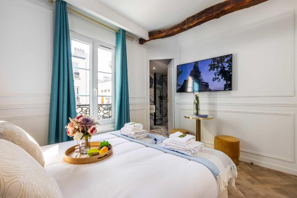 Posteľ alebo postele v izbe v ubytovaní CMG - Résidence Sacré Coeur - MONTMARTRE