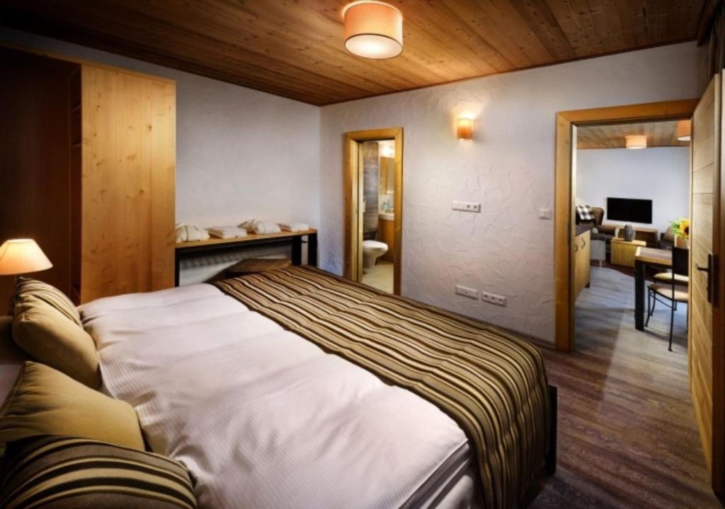 Postel nebo postele na pokoji v ubytování Chalets Jasná Collection - Apartments