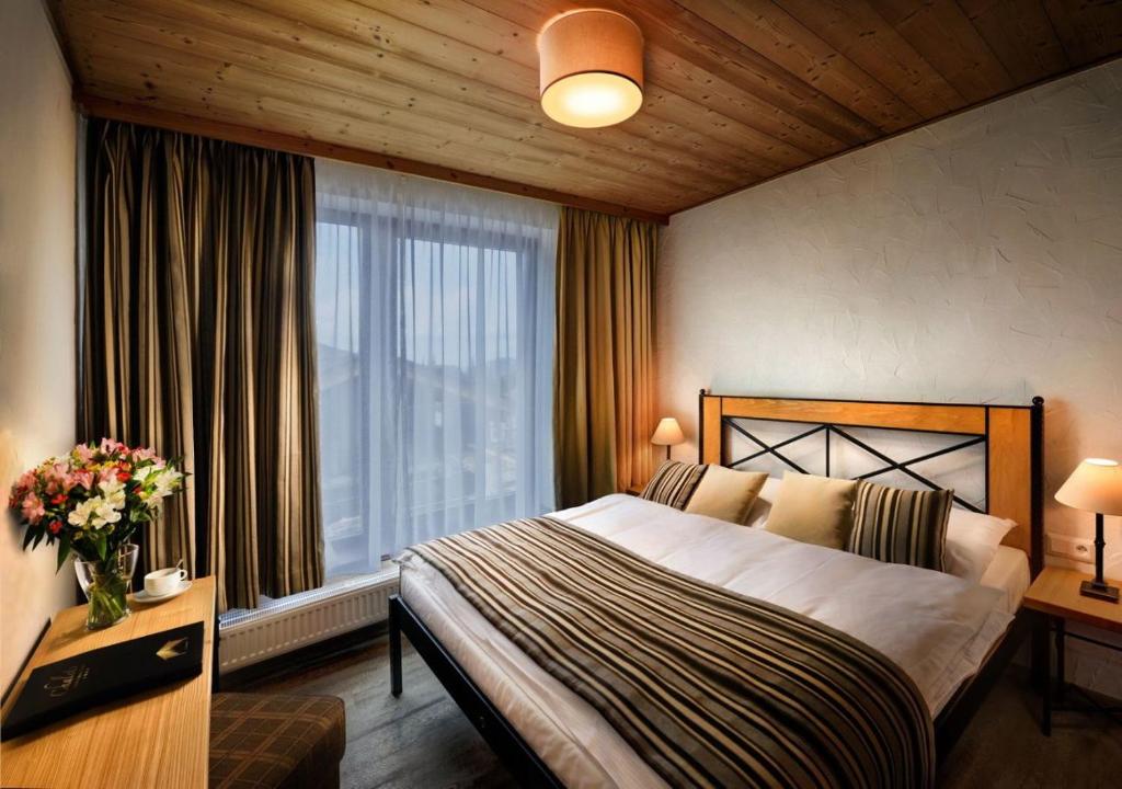 Postel nebo postele na pokoji v ubytování Chalets Jasná Collection - Apartments