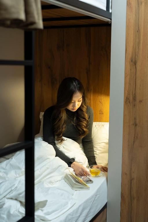 Postel nebo postele na pokoji v ubytování Aiva Hostel
