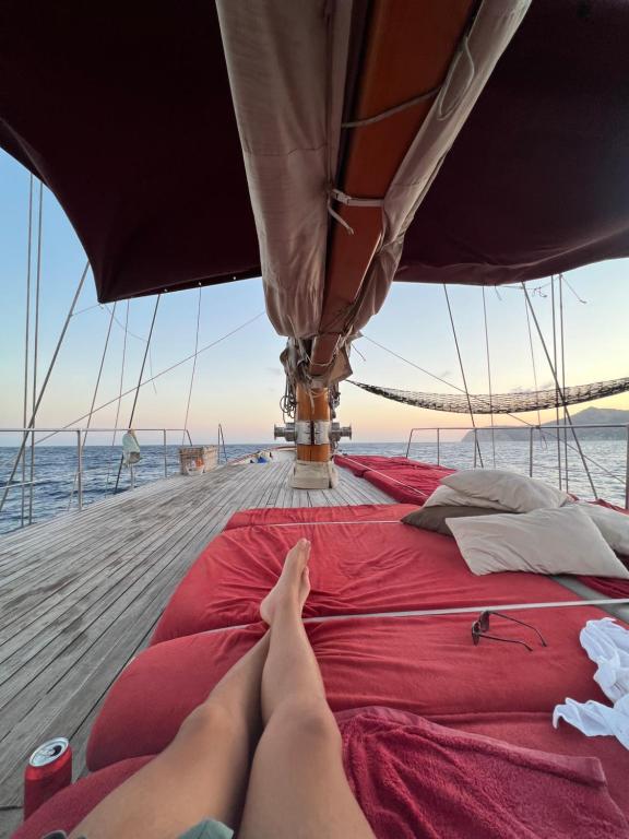 a person laying on the deck of a boat at Southern Cross in Barcelona