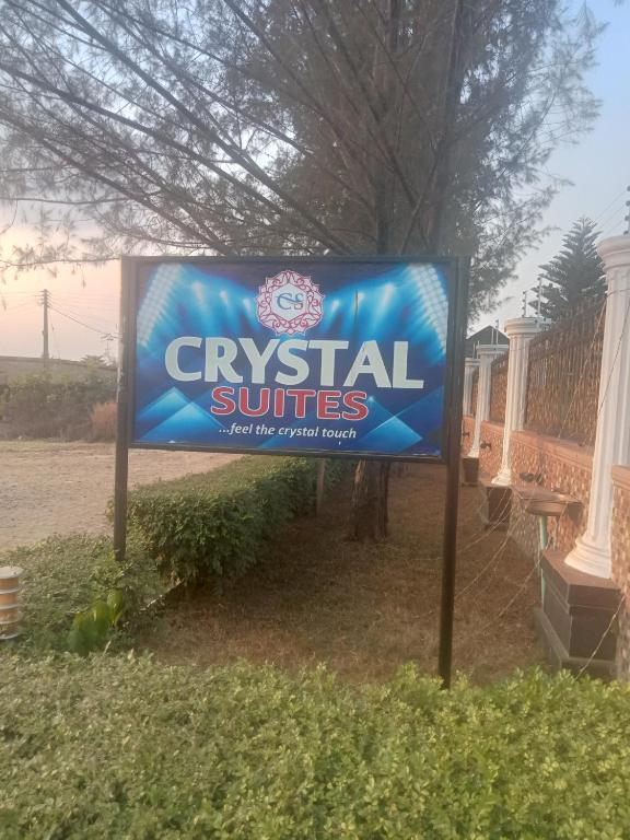 a sign for auclesiastical services in front of a house at CRYSTAL SUITES in Akure