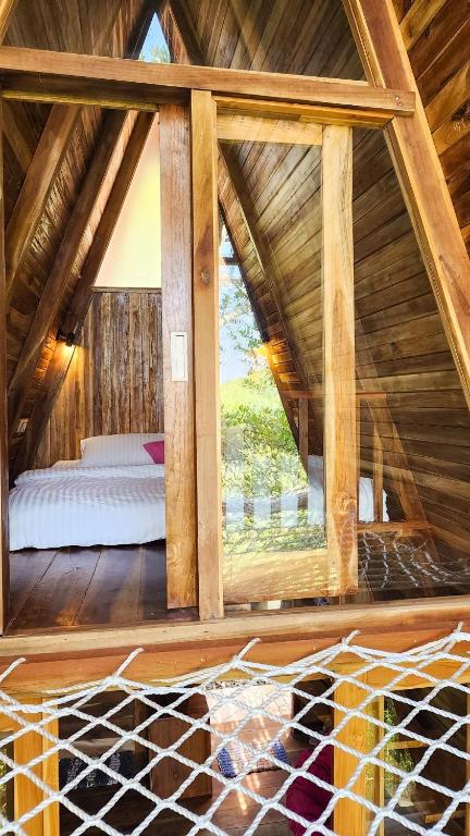 Postel nebo postele na pokoji v ubytování Munduk Umah Cabin