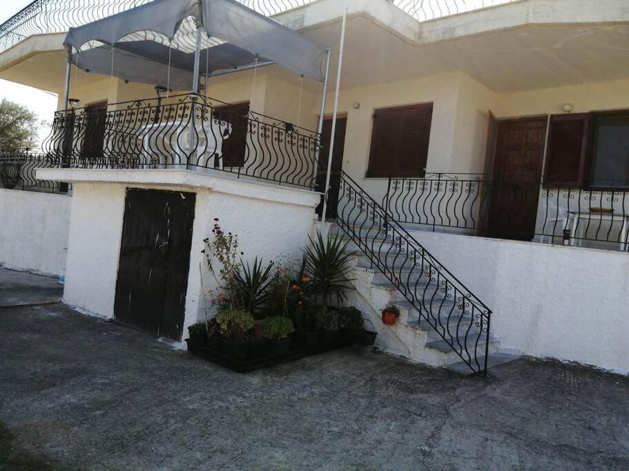 a house with a staircase and a balcony at Cozy Rodas House 2 in Politika