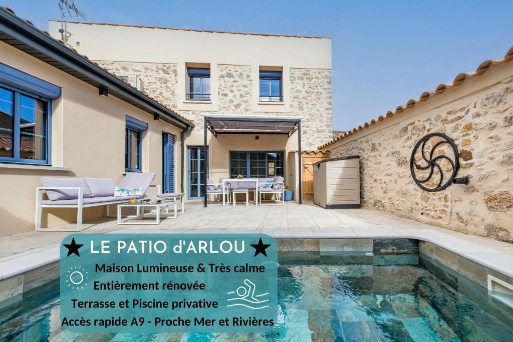 a villa with a swimming pool and a house at Le Patio d'Arlou, Maison de caractère in Fabrezan