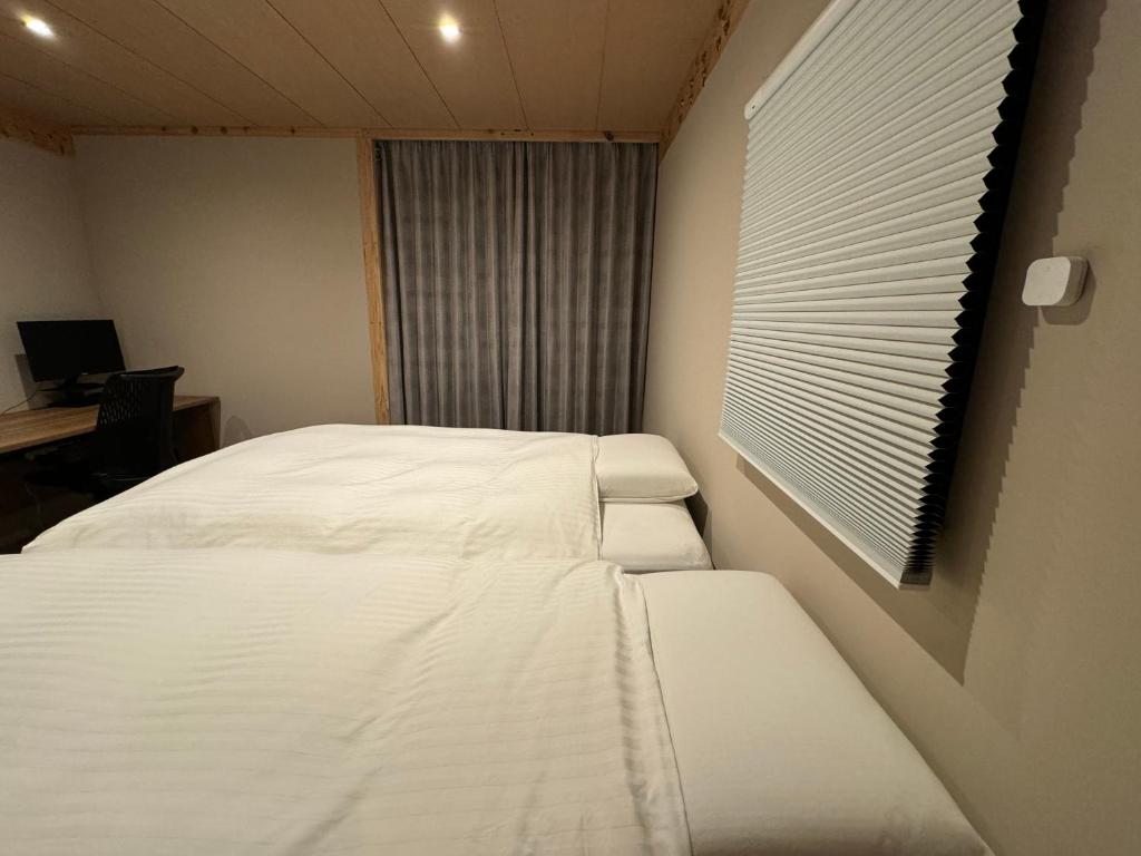 Postel nebo postele na pokoji v ubytování ARTISANAL