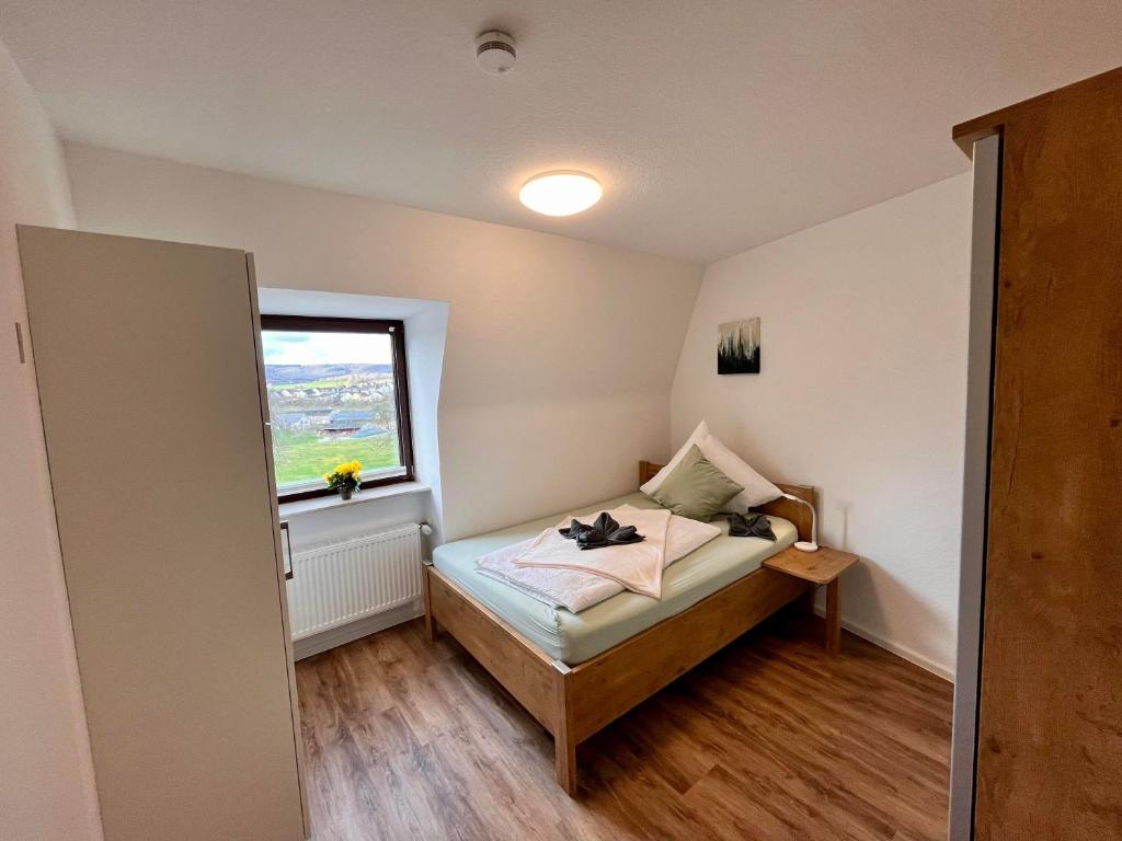 Postel nebo postele na pokoji v ubytování Aparthotel Tannenhof
