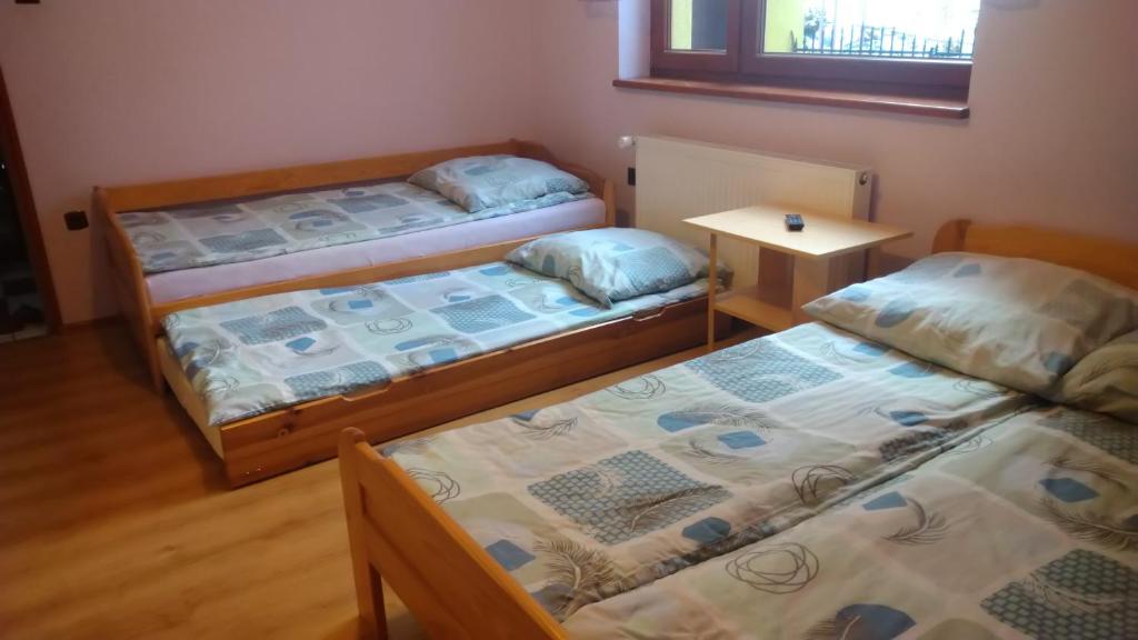 Postel nebo postele na pokoji v ubytování Nad Strumykiem