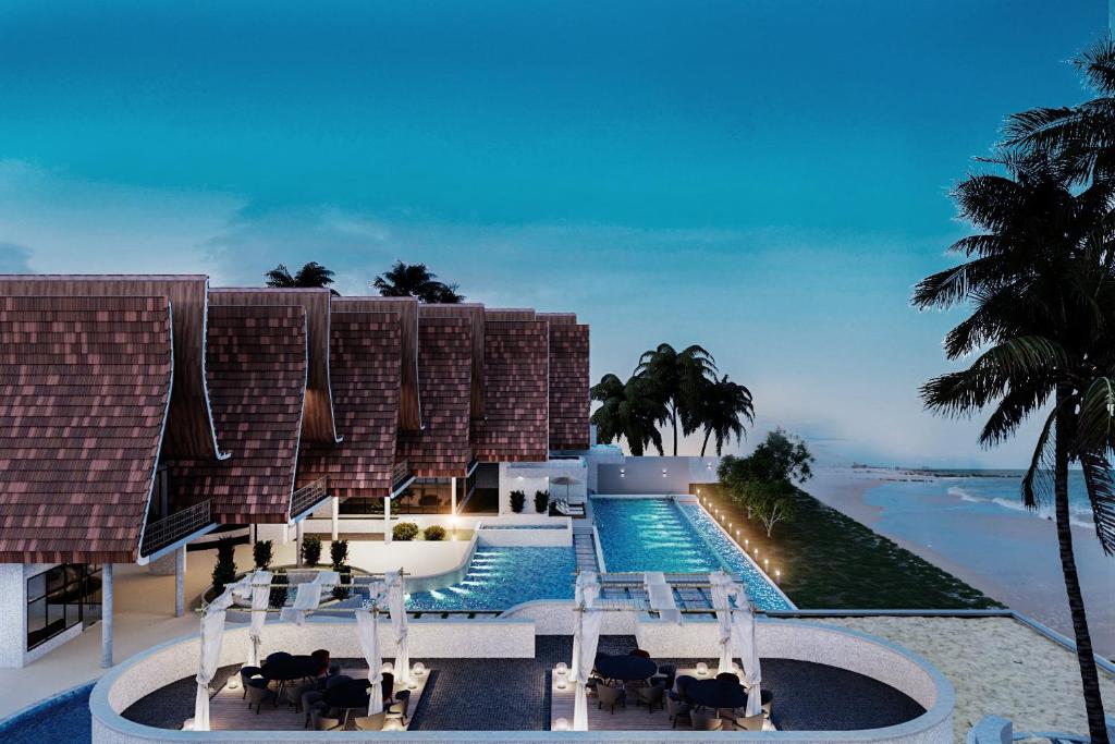 een uitzicht op een resort met een zwembad bij YOLO Island Resort 