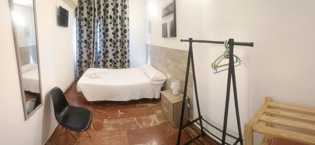 A bed or beds in a room at Hostal Nevot