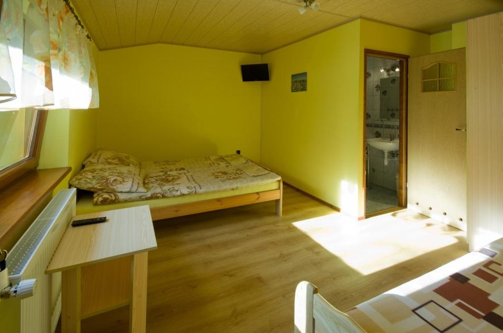 Postel nebo postele na pokoji v ubytování Nad Strumykiem