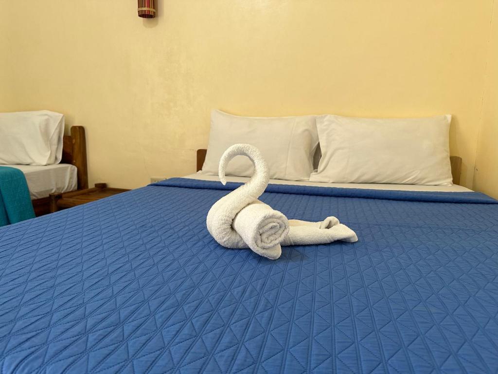 Postel nebo postele na pokoji v ubytování Dancalan Beach Resort