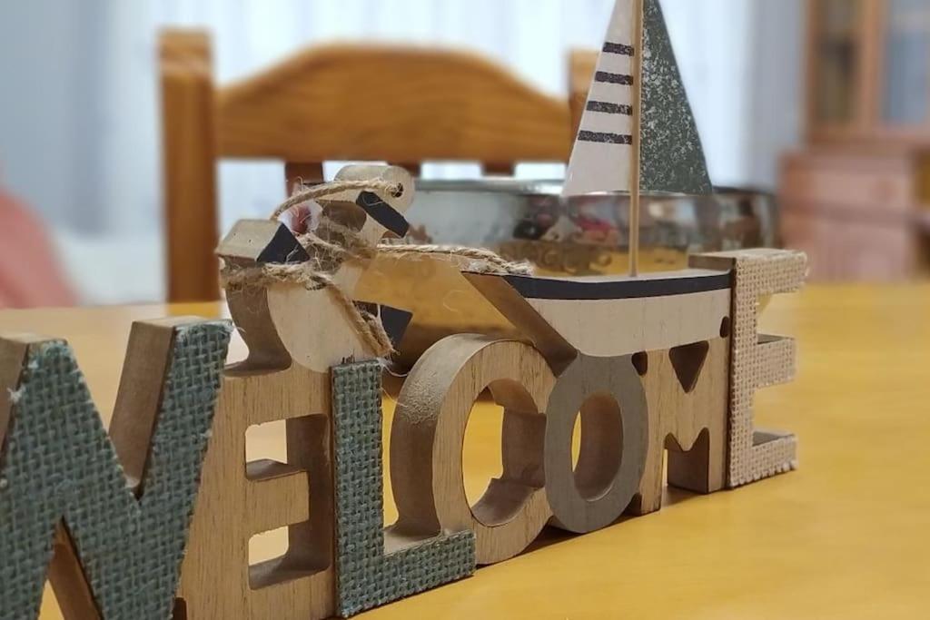 a wooden toy train on top of a table at Acogedor apartamento en la playa de Canet in Canet de Berenguer