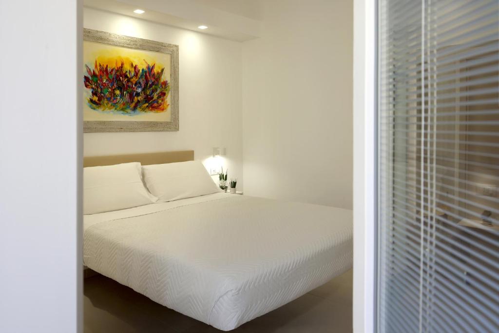 Giường trong phòng chung tại Ruffini Rooms