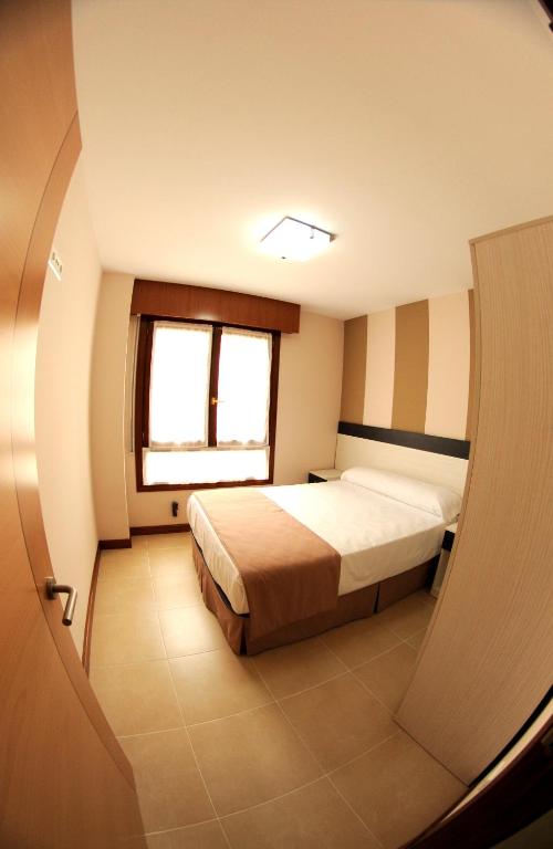 Posteľ alebo postele v izbe v ubytovaní Apartaments La Reserva Premium