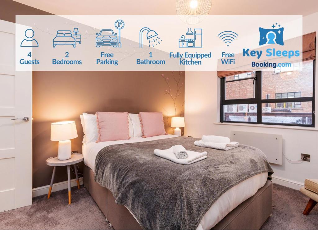 a bedroom with a bed with a poster on the wall at Central Two Bedroom Apartment By Keysleeps Short Lets Hull With Free Parking Leisure Contractor in Hull