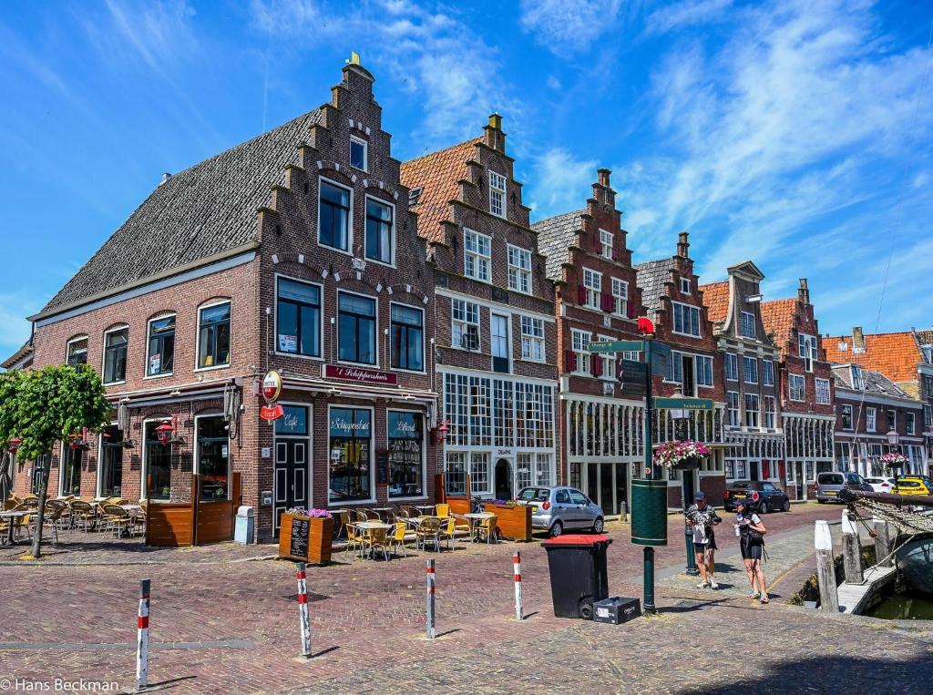 a group of buildings on a city street at Camping 't Venhop in Berkhout