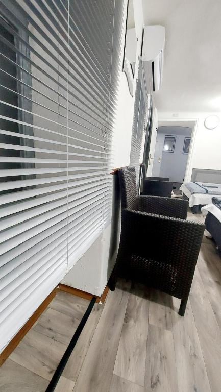 Televízia a/alebo spoločenská miestnosť v ubytovaní Basilica Centrum Apartment Budapest
