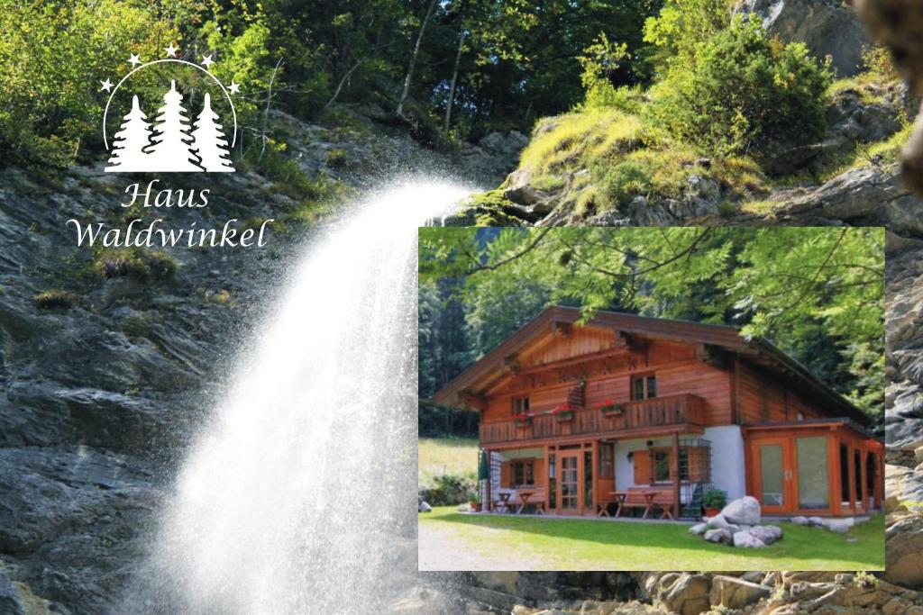 uma casa ao lado de uma cascata com as palavras hakus wallund em Ferienwohnungen Haus Waldwinkel em Aschau im Chiemgau