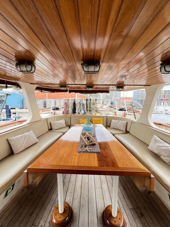 a wooden table in the center of a boat at Southern Cross in Barcelona