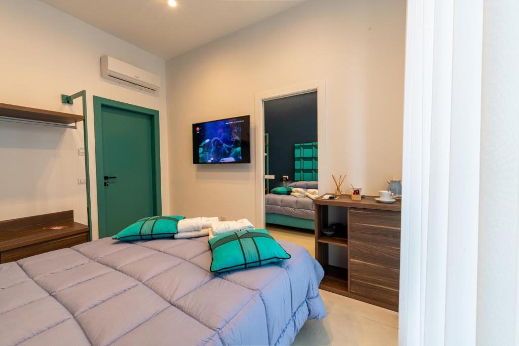 Postel nebo postele na pokoji v ubytování FRAN CITY SUITE