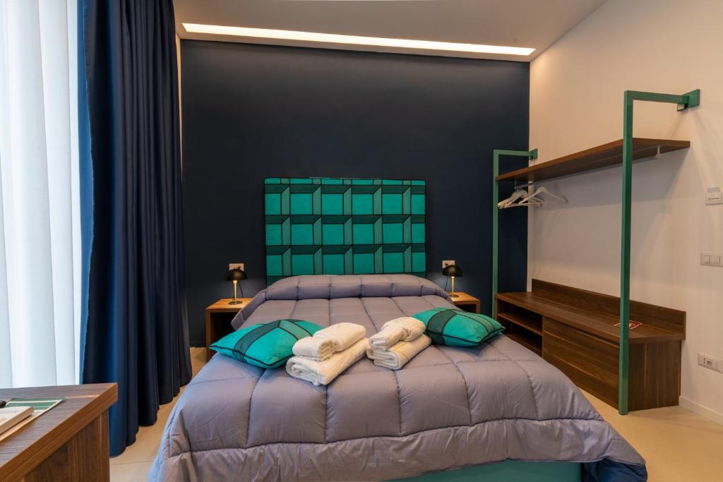 Postel nebo postele na pokoji v ubytování FRAN CITY SUITE