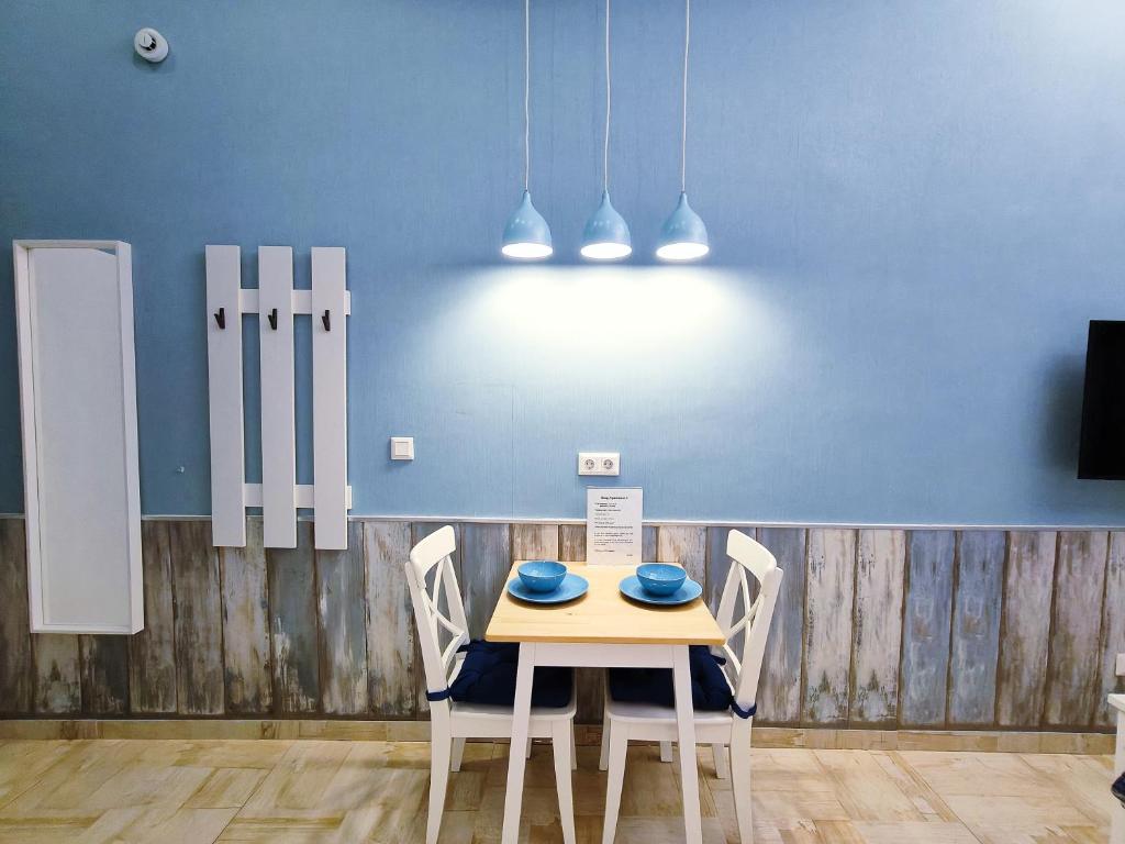 Televízia a/alebo spoločenská miestnosť v ubytovaní King Apartment