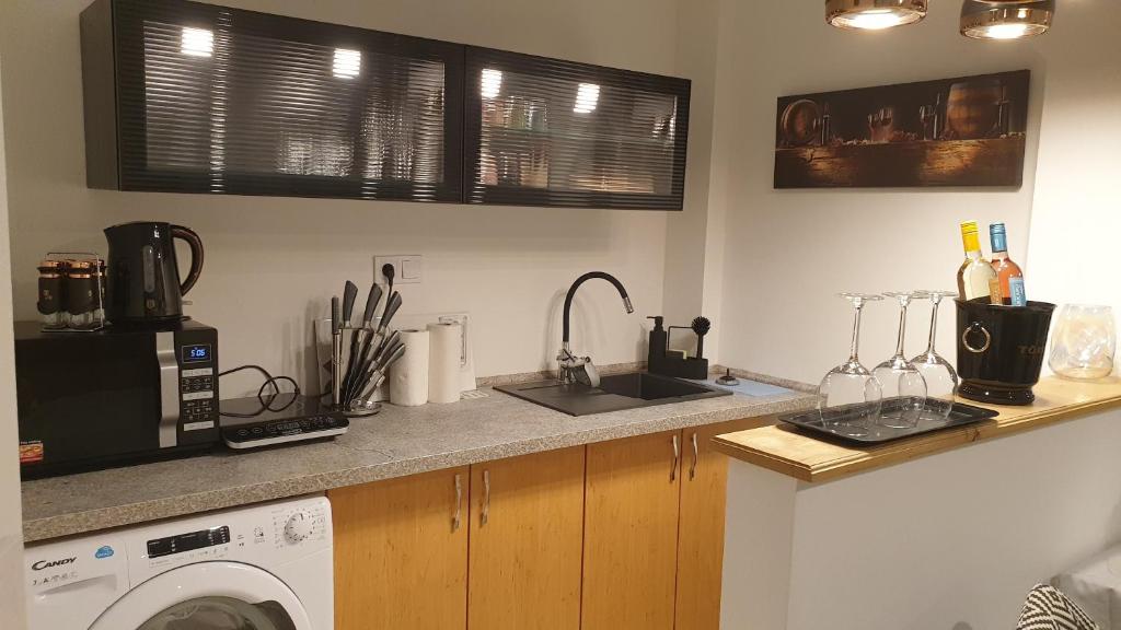 Kuchyň nebo kuchyňský kout v ubytování Vár-i Apartman