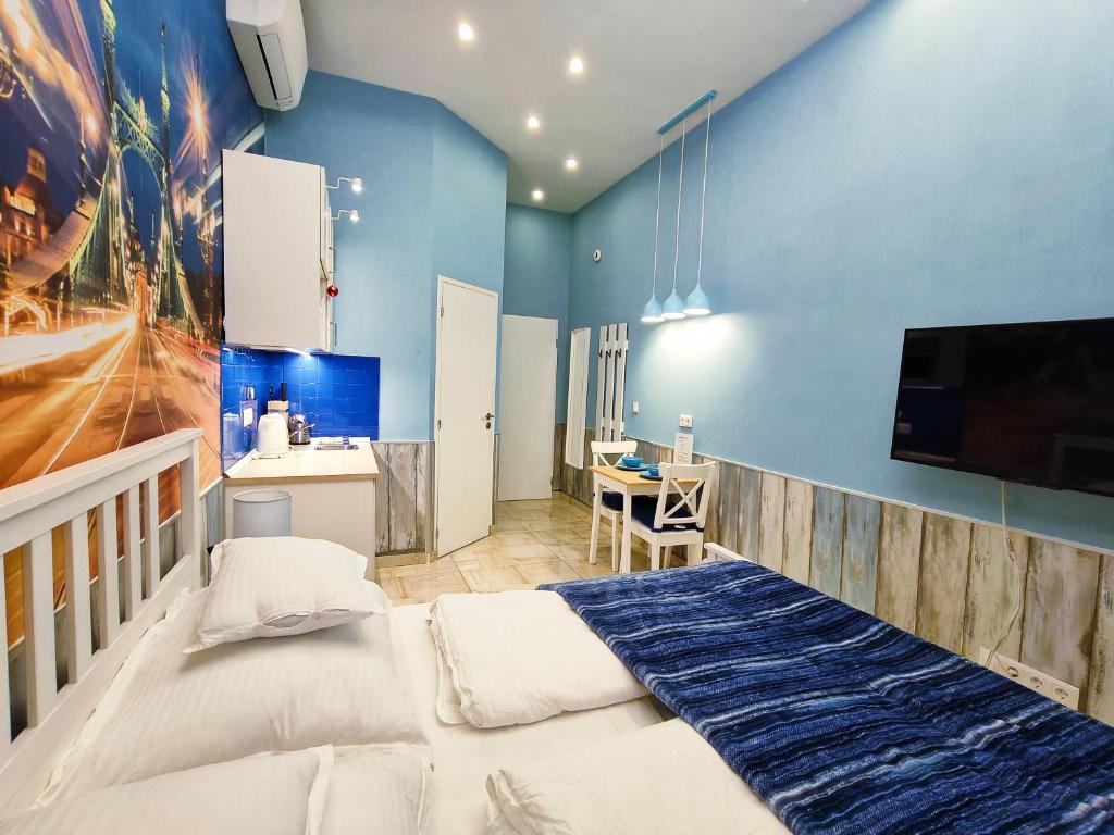 Posteľ alebo postele v izbe v ubytovaní King Apartment